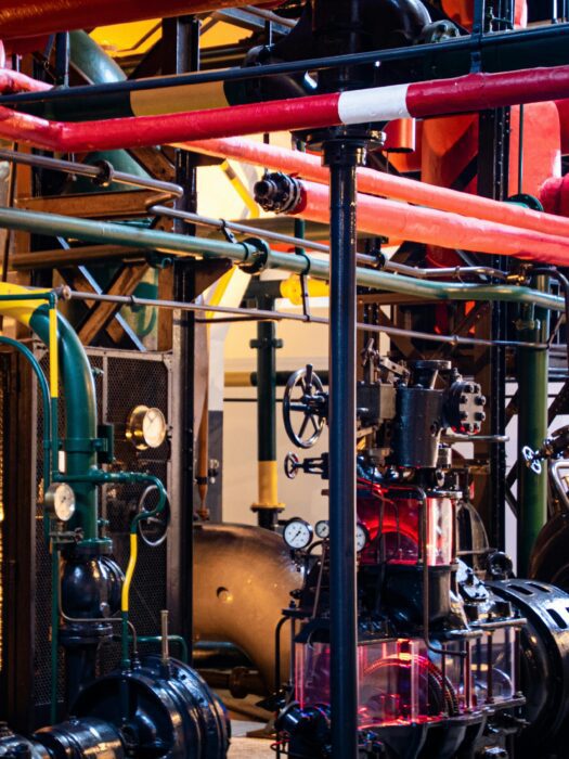 A complex system of pipes in a building.
