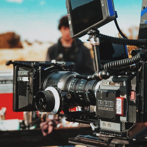 A professional film camera on an outdoor set with