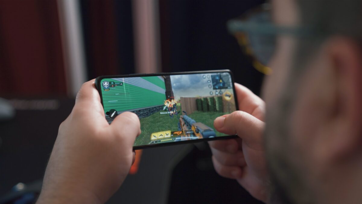 Person playing a game on their mobile phone