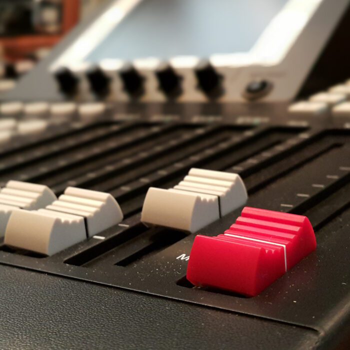 Faders on a soundboard