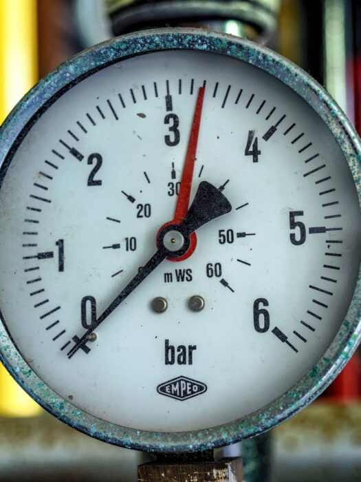 A gauge showing air pressure in bars.