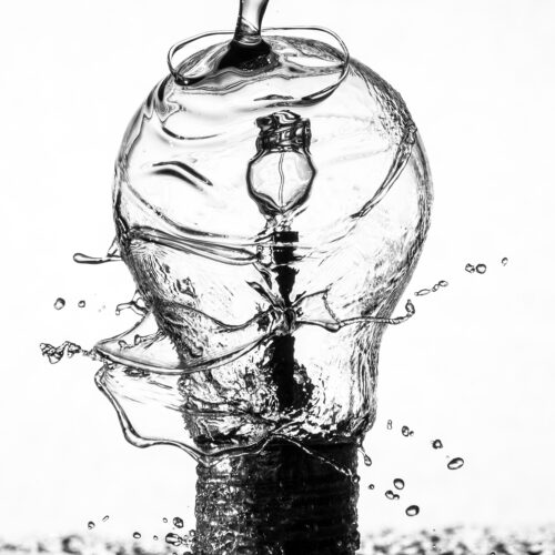 Water streaming over lightbulb