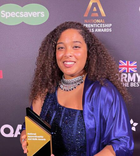 Fernanda holding an award