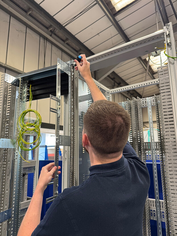 Daniel constructing a rack in the workshop.
