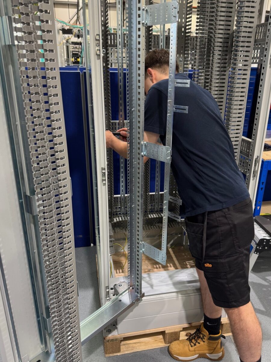 Luke assembling a cabinet in the workshop.