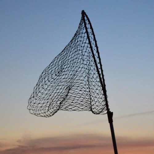 Fishing net against a sunset